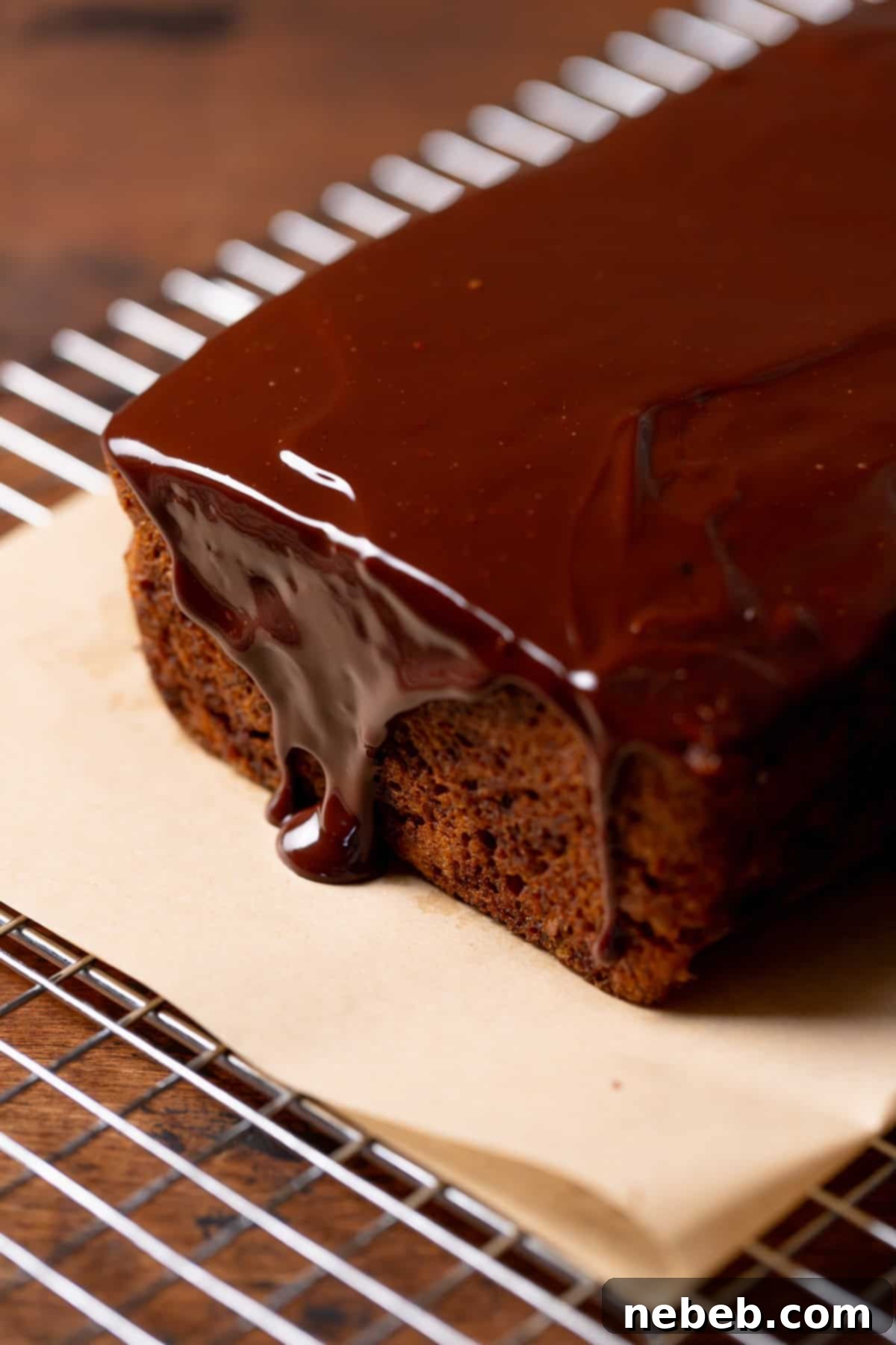 Banana bread with the decadent chocolate glaze poured over the top, ready to be served.