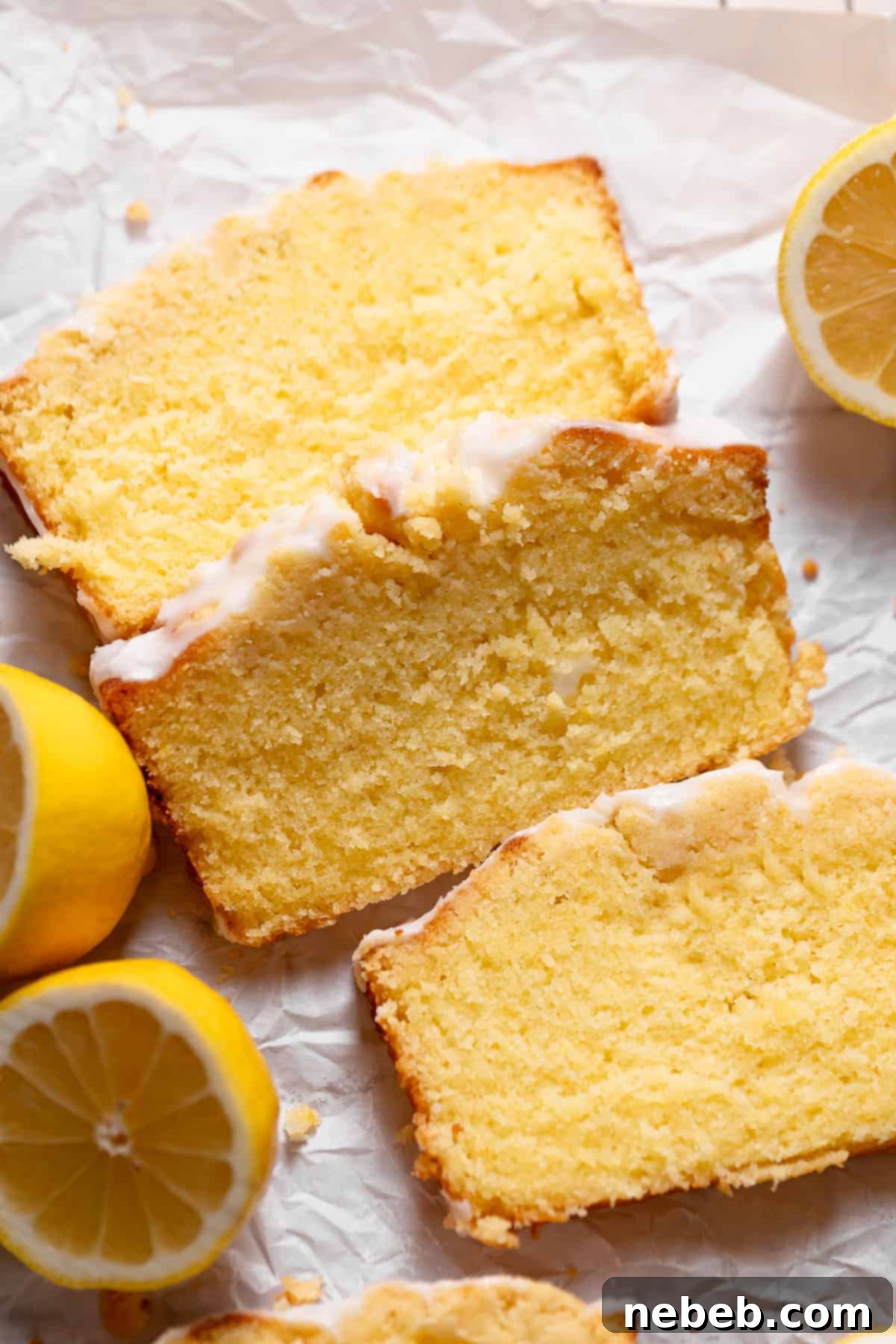 Lemon cake slices on white parchment paper.