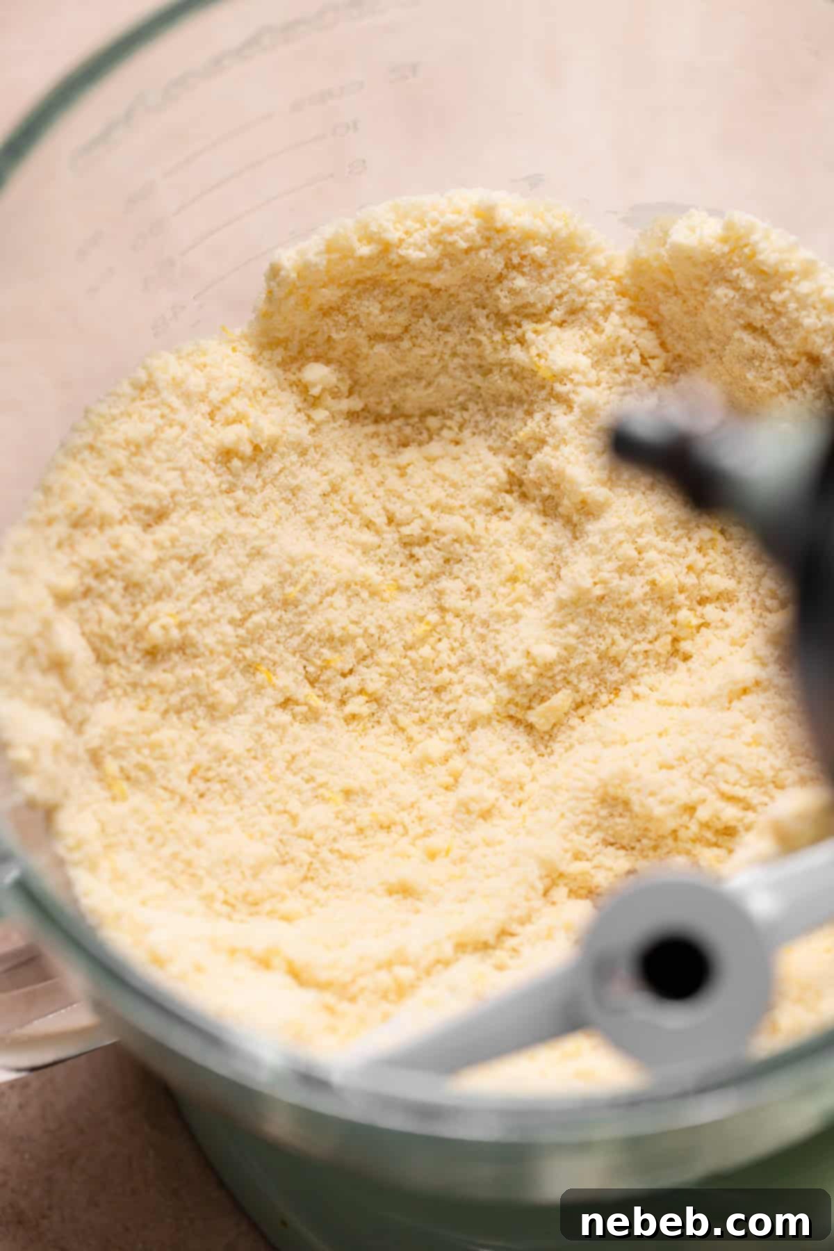 A mixing bowl with the butter mixed into the dry ingredients.