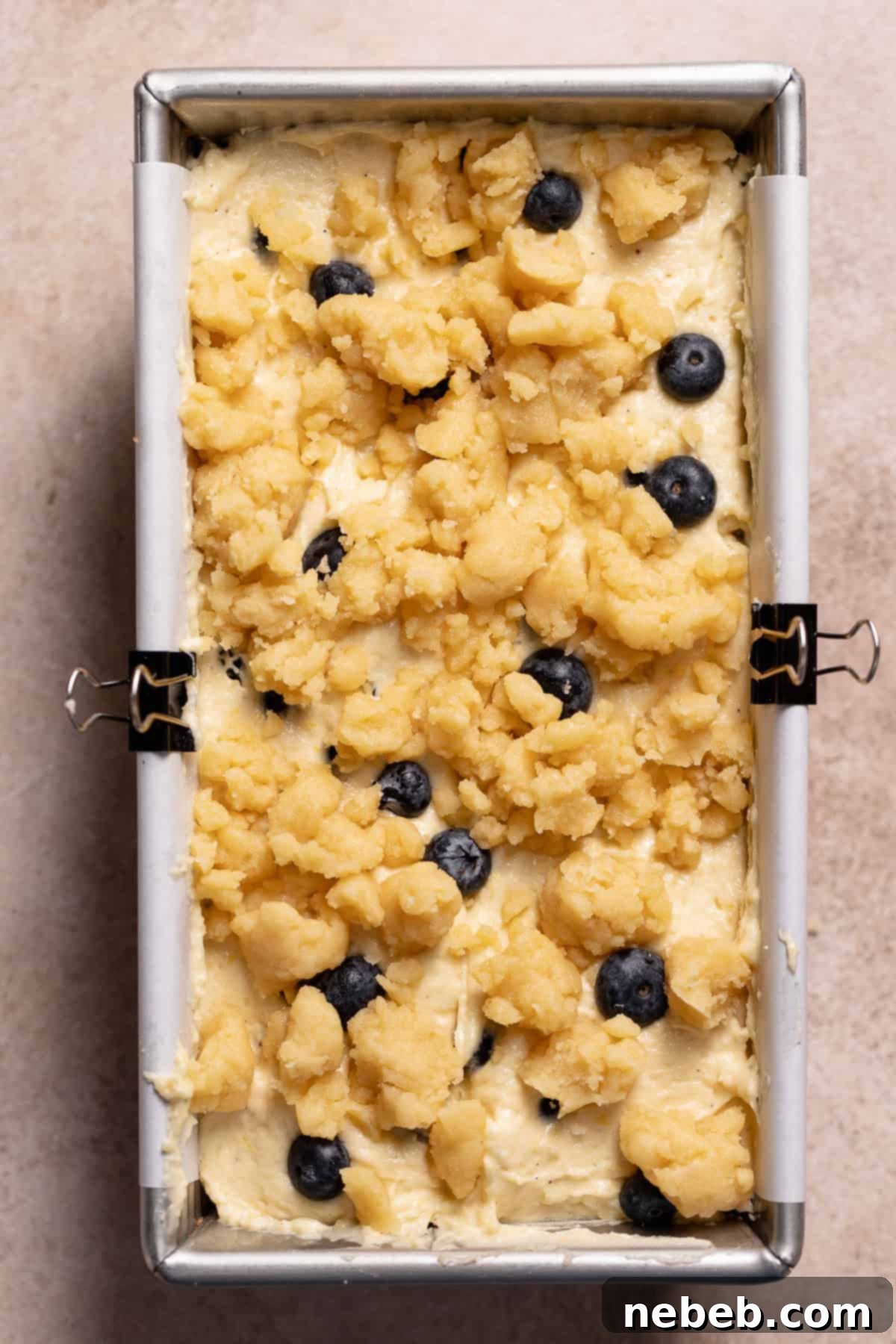 The blueberry lemon loaf with crumble topping before baking.