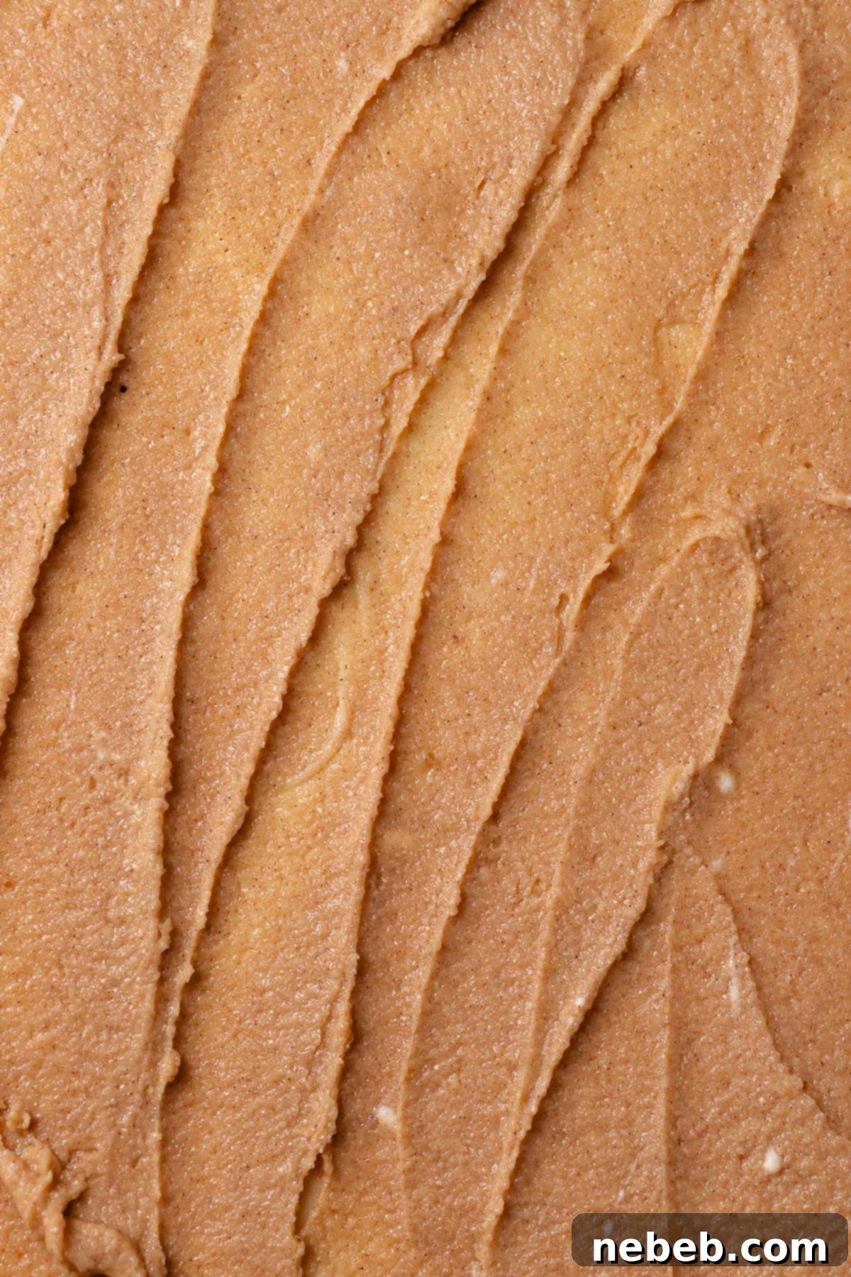 The almond frangipane filling spread across the cinnamon roll dough.