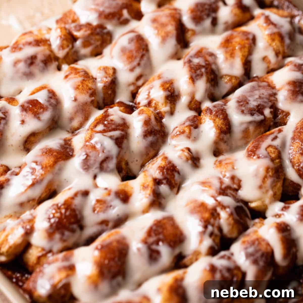 Gooey cinnamon roll sticks on a baking tray.