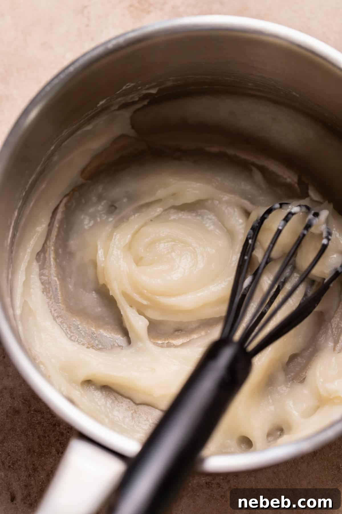 Decadent Banana Pudding Cinnamon Rolls 3 A pot with the cooked tangzhong mixture, a thick paste.