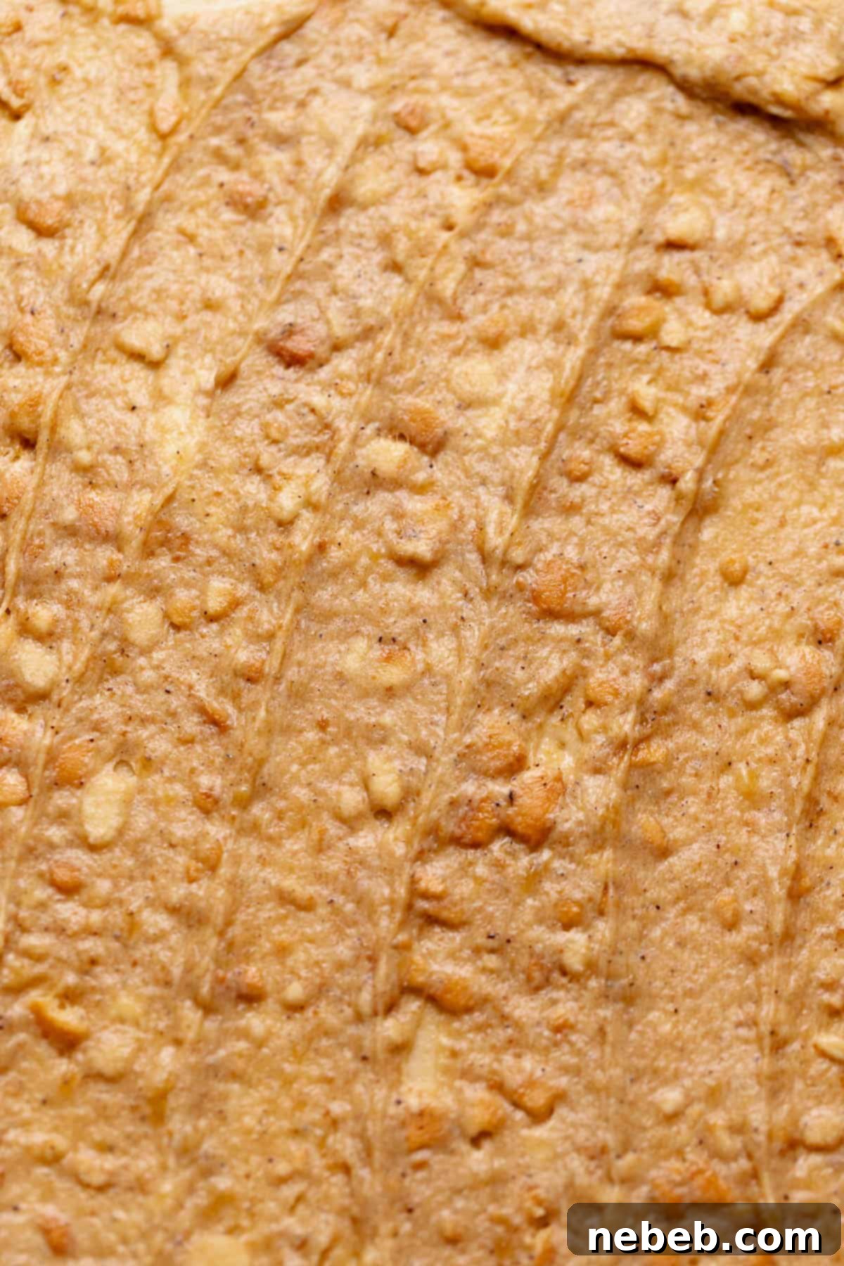 Decadent Banana Pudding Cinnamon Rolls 8 Cinnamon dough rolled out with the banana pudding filling spread evenly across it.