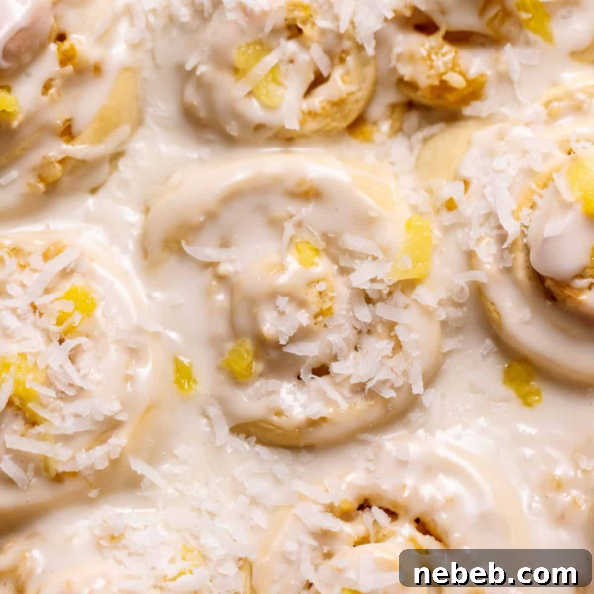 Pineapple coconut rolls in a baking pan.