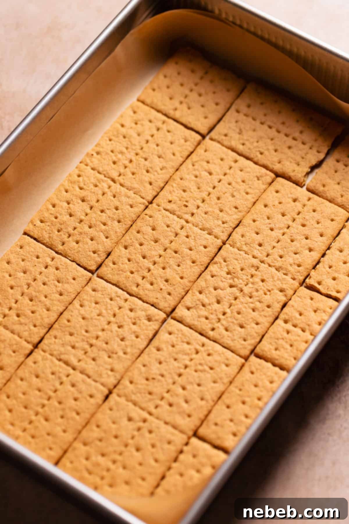 Graham crackers placed on the bottom of a 9x13 baking pan.