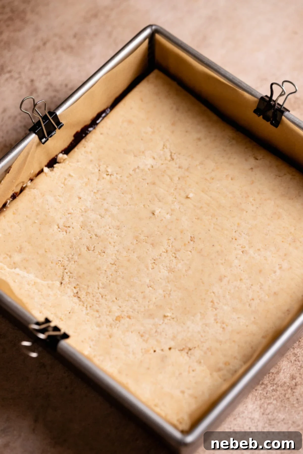 Unbaked smores bars in a metal baking pan.