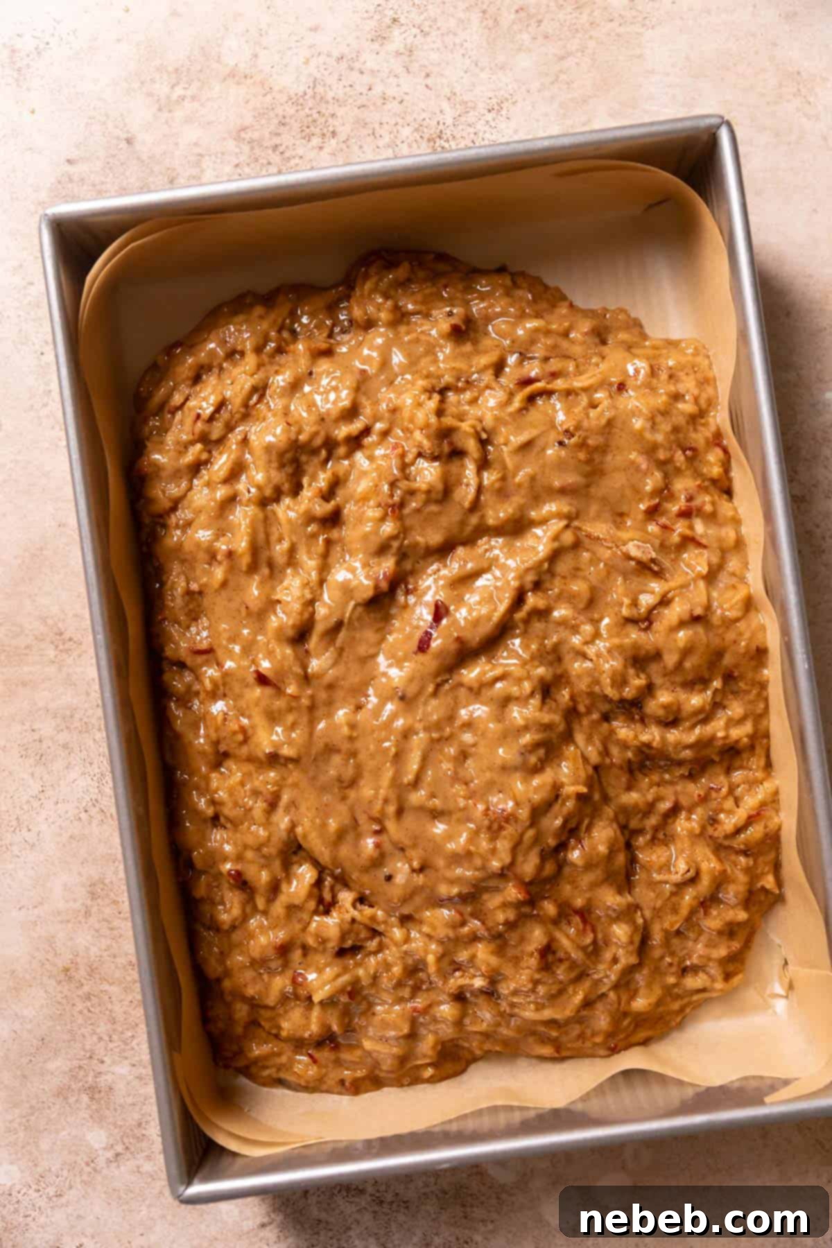 Best Ever Cinnamon Apple Cake 7 Apple batter spread evenly into a large baking pan, ready for the crumb topping.