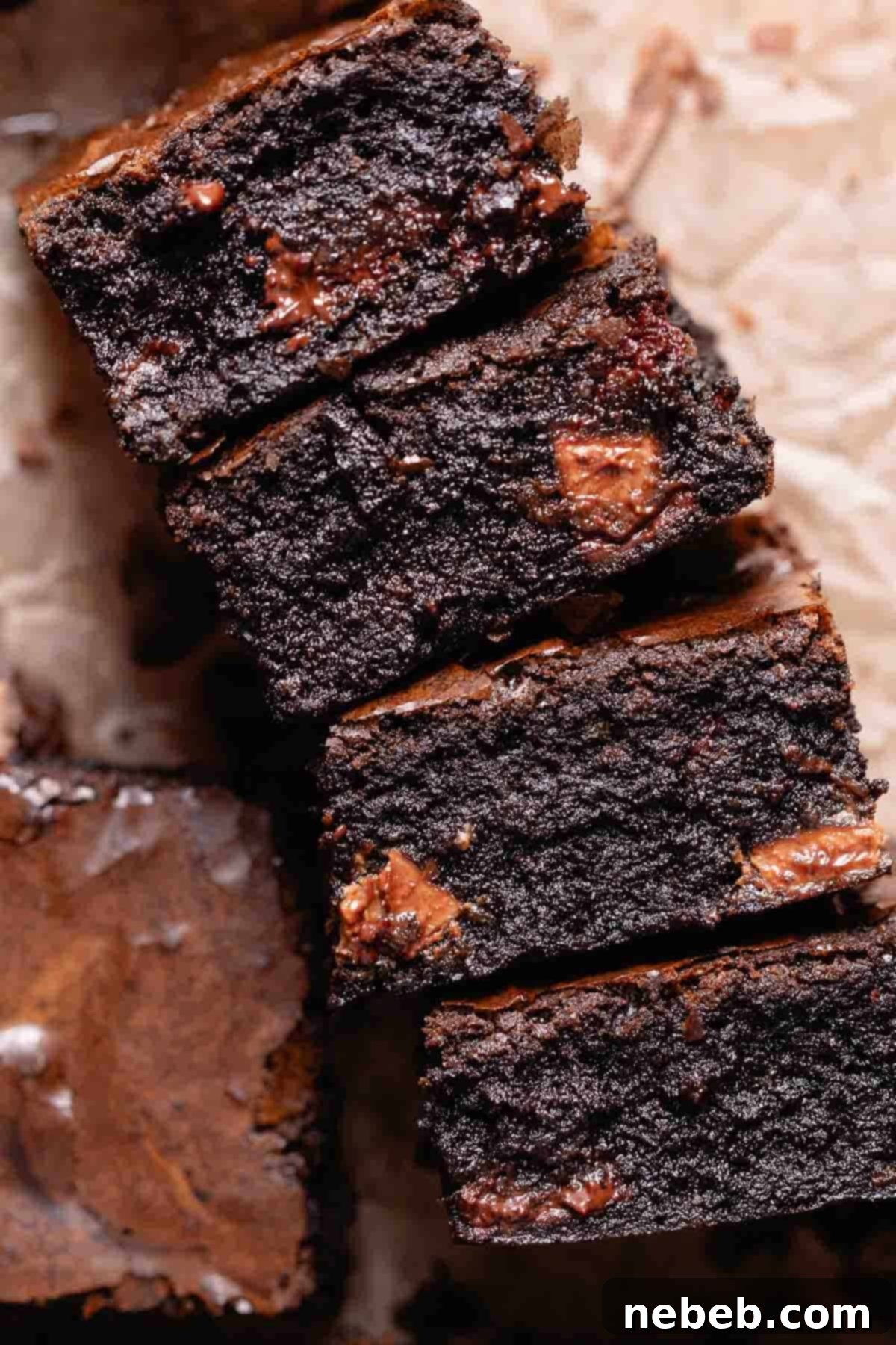 A stack of miso brownies on their sides to show the fudgy texture.