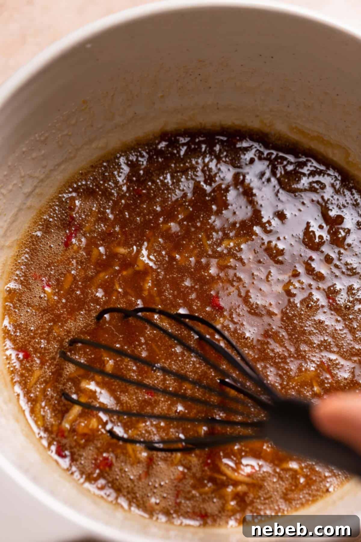 A mixing bowl with the whisked wet ingredients.