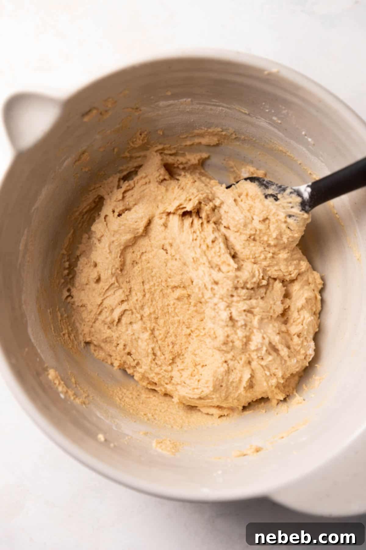 Peanut butter cookie dough in a mixing bowl.