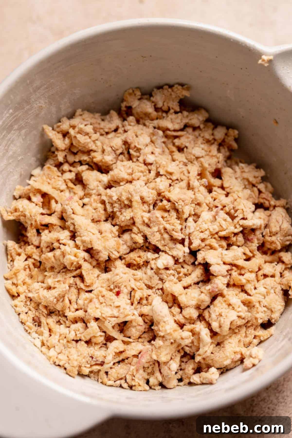 A mixing bowl with the apple scone dough before shaping.