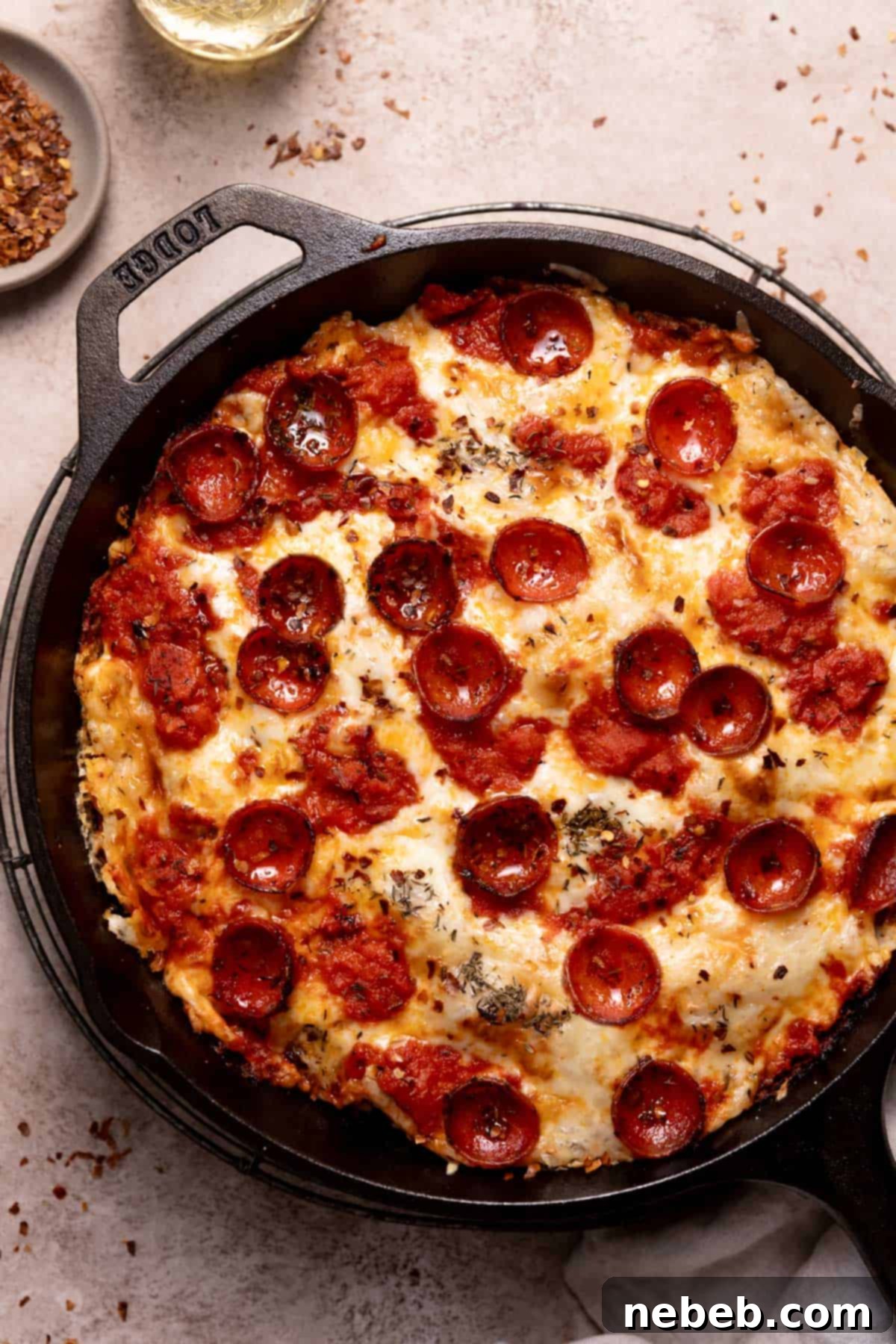 cast iron skillet pizza with cheese and pepperoni.