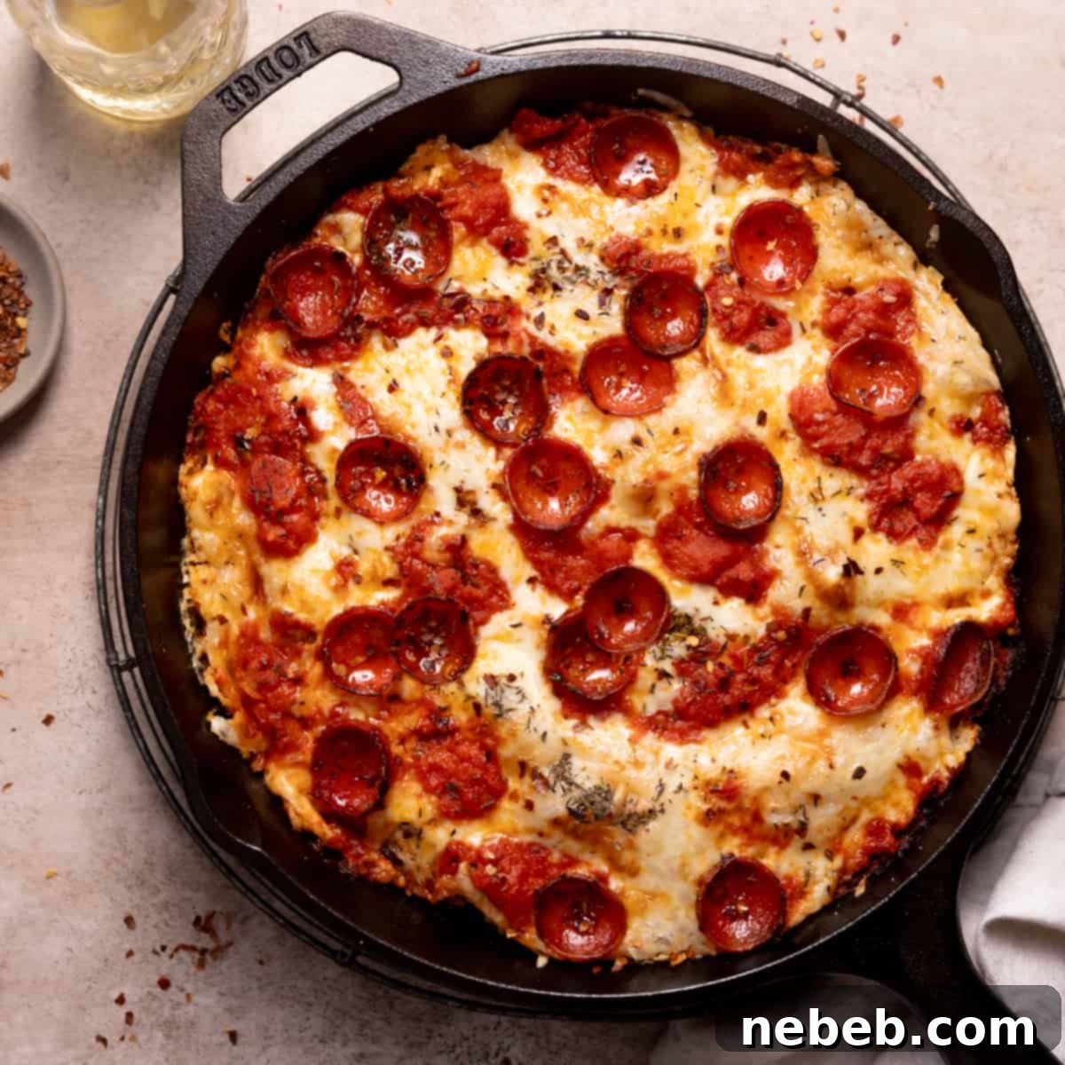 cast iron skillet pizza with cheese and pepperoni.