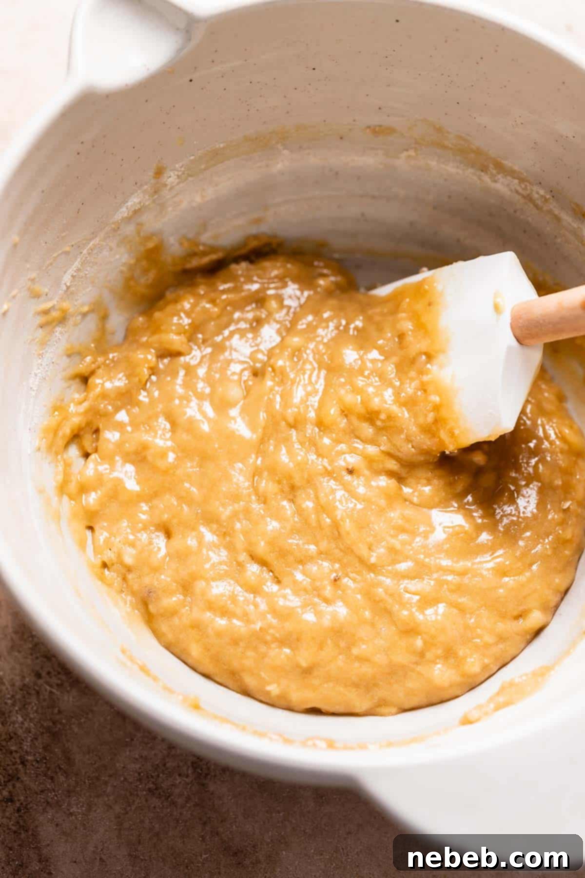 A mixing bowl with the raw banana brownie batter.