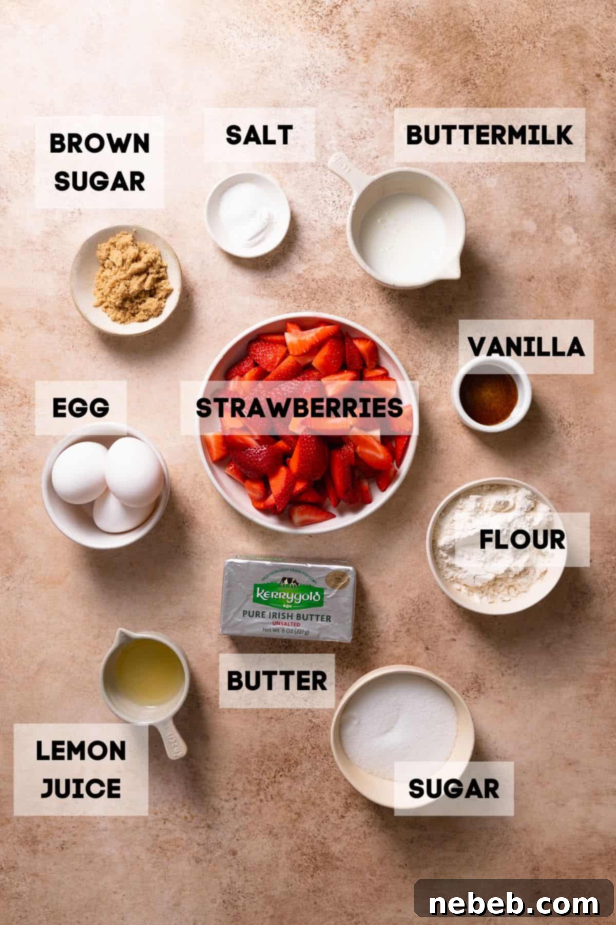 Bowls of ingredients for strawberry crumble cake, including fresh strawberries, flour, sugar, and butter.