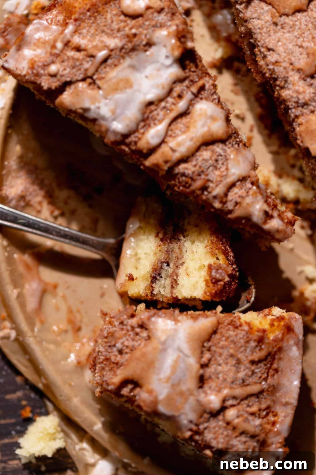 A bite of cinnamon sugar coffee cake on a spoon.