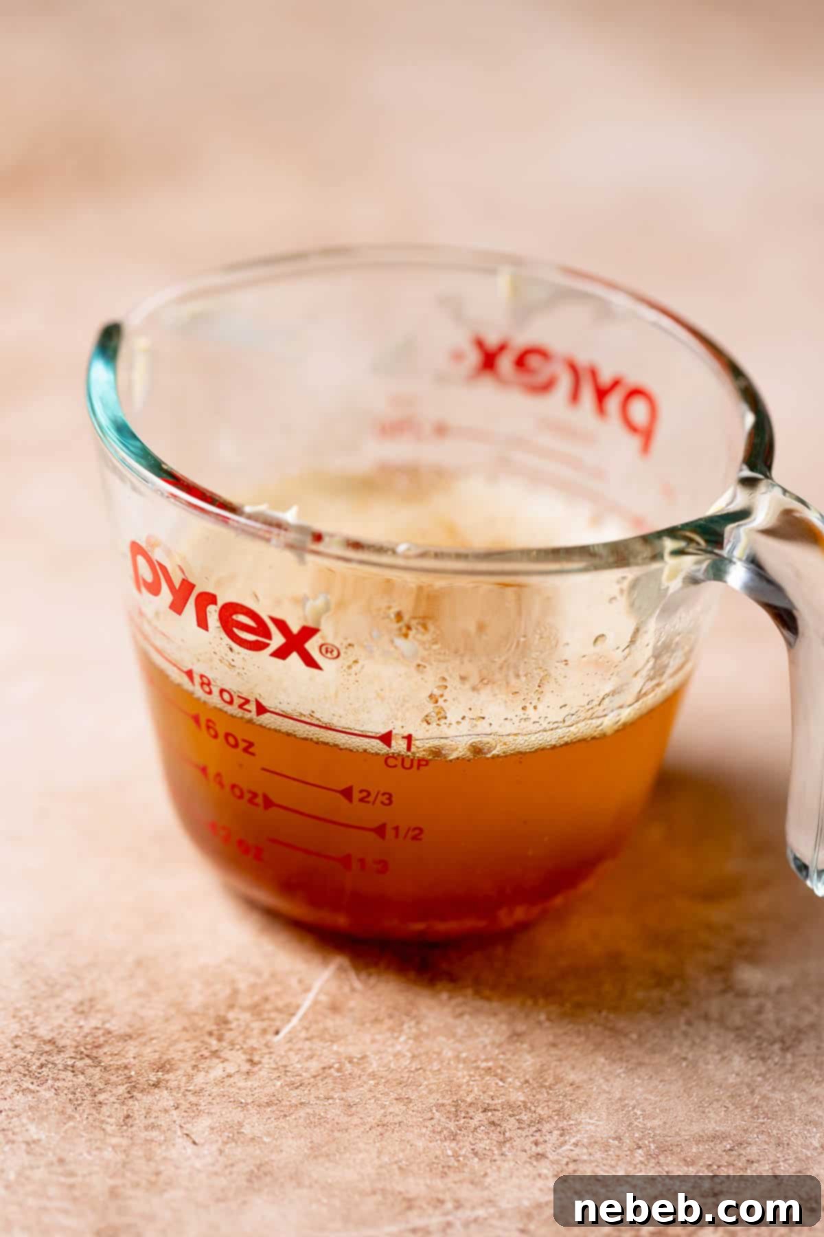 Perfect Brown Butter Snickerdoodles 3 A glass measuring cup with browned butter.
