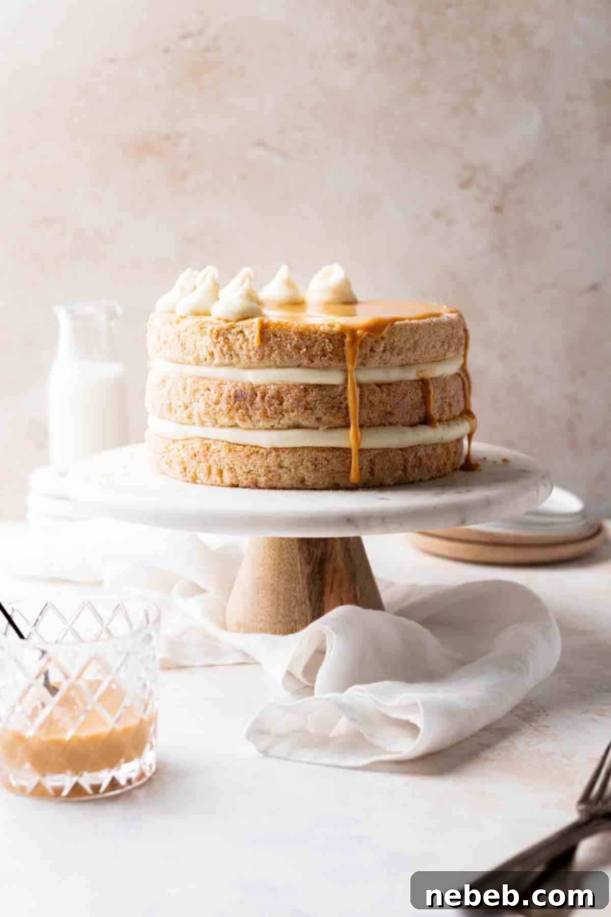 Cinnamon Sugar Dream Cake 2 churro cake on a cake stand.