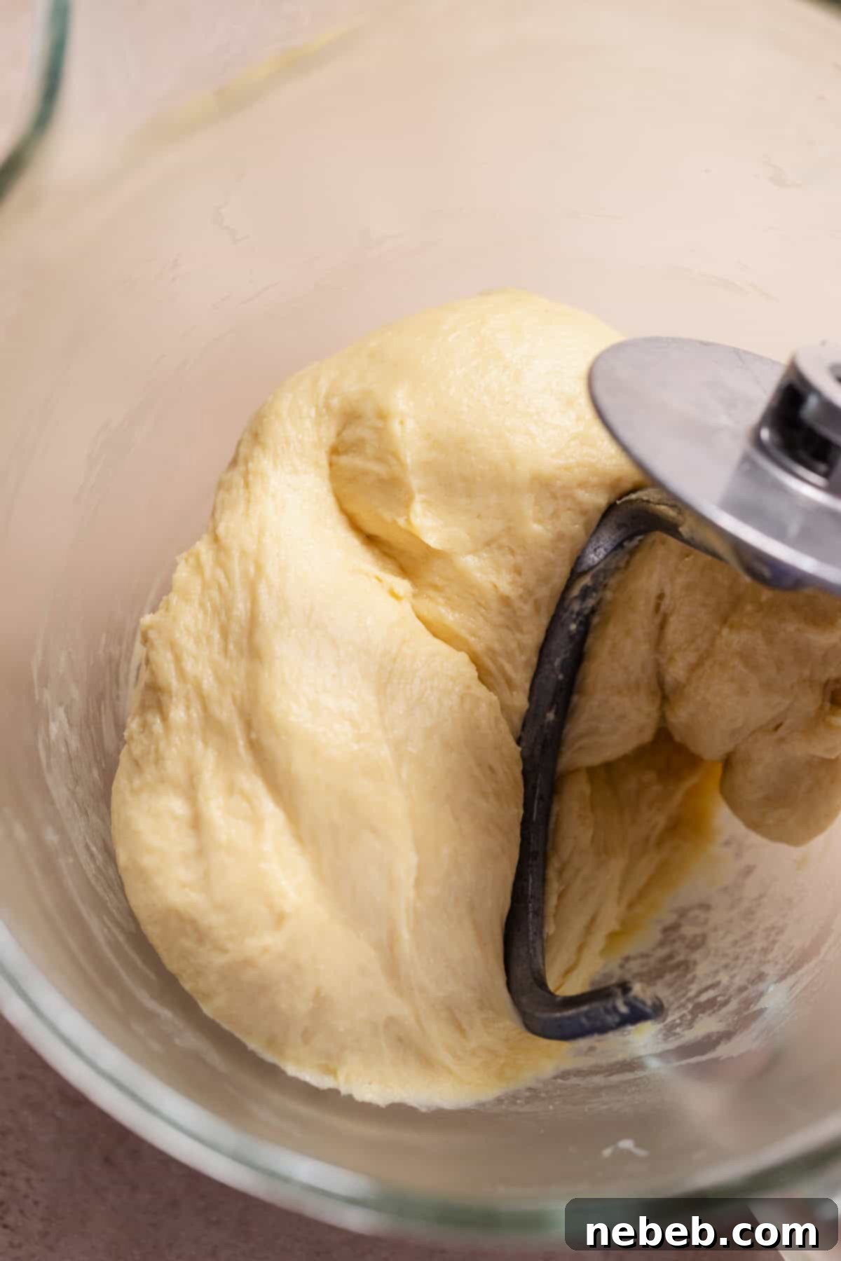 Homemade Apple Fritters So Good You Will Skip The Bakery 4 Soft kneaded fritter dough in a glass mixing bowl.
