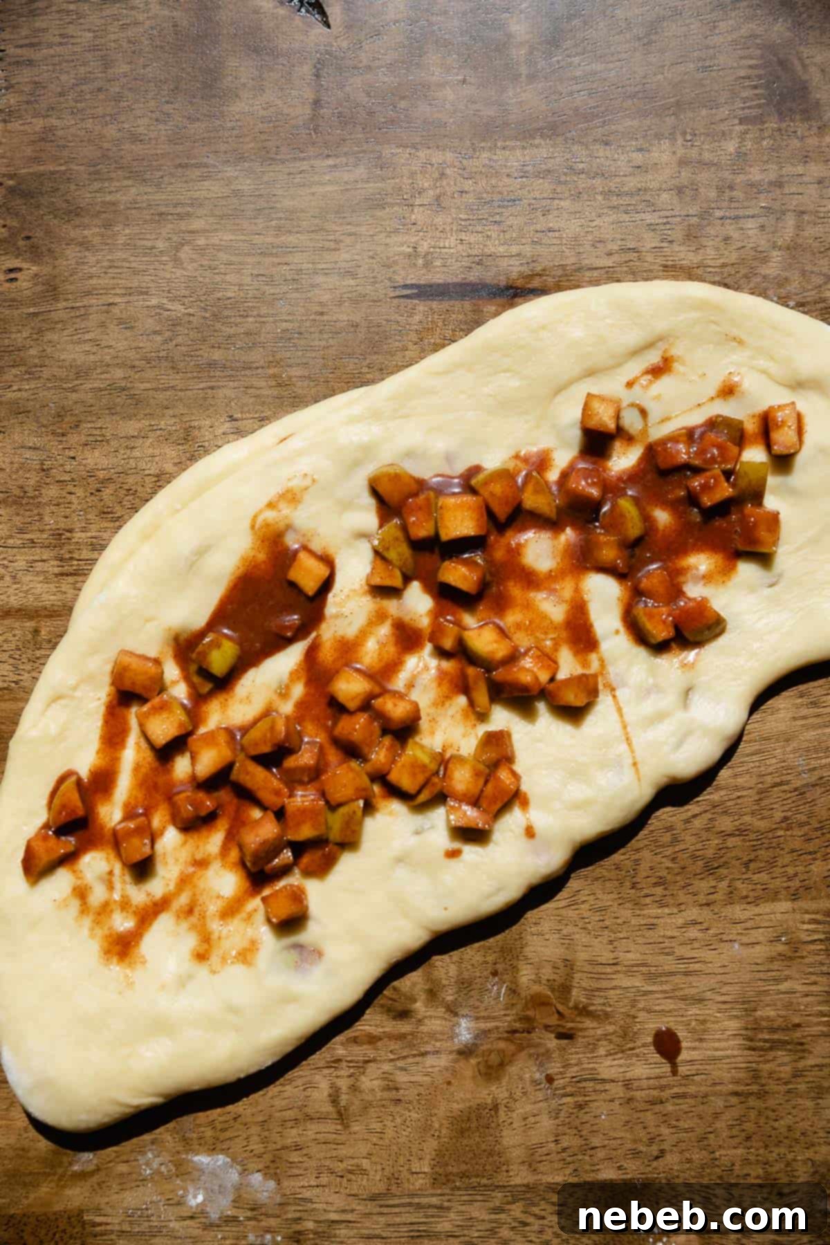 Homemade Apple Fritters So Good You Will Skip The Bakery 5 Laying the cinnamon apples on top of the fritter dough.