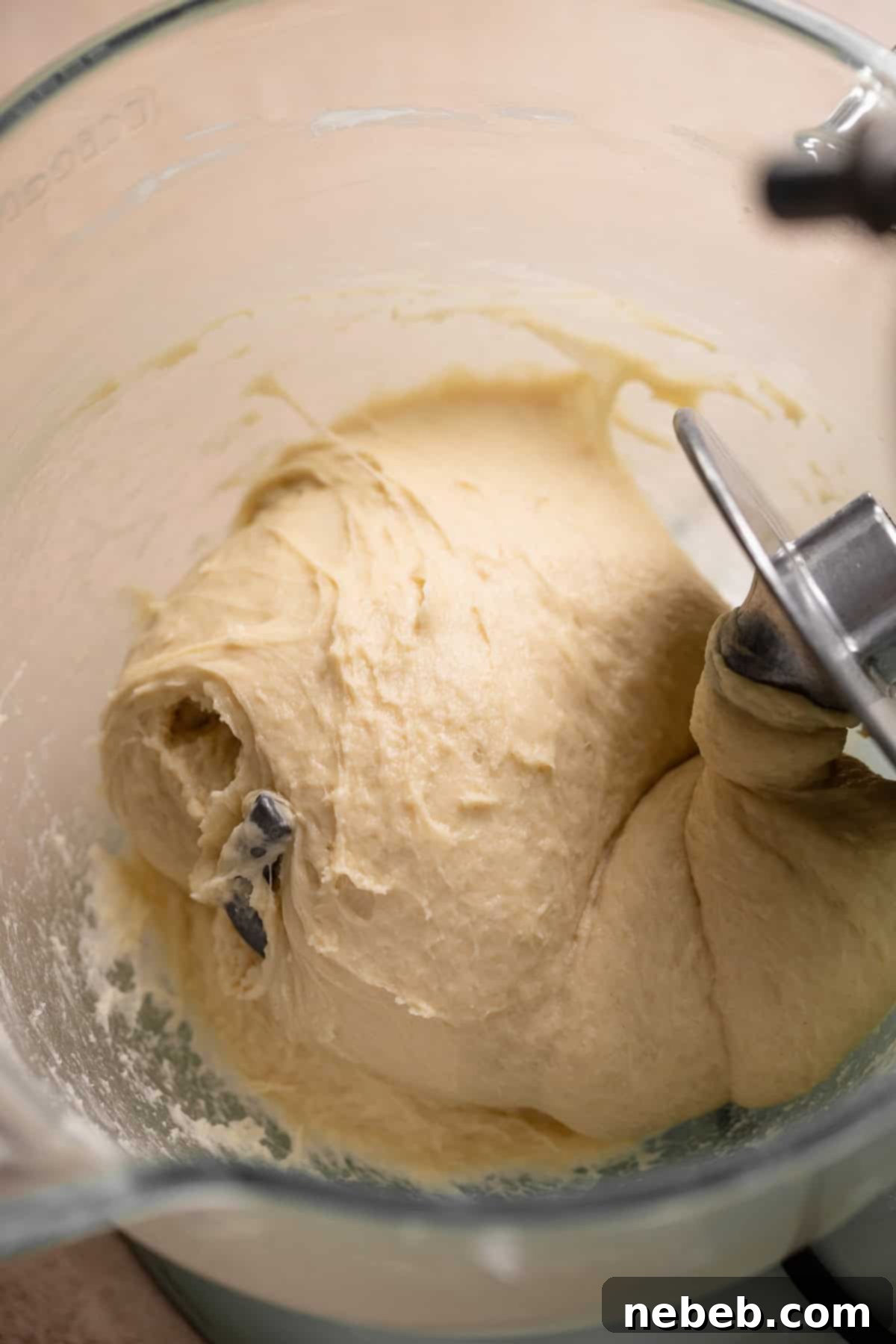 Glistening Salted Caramel Doughnuts 4 Doughnut dough in a glass mixing bowl after kneading.