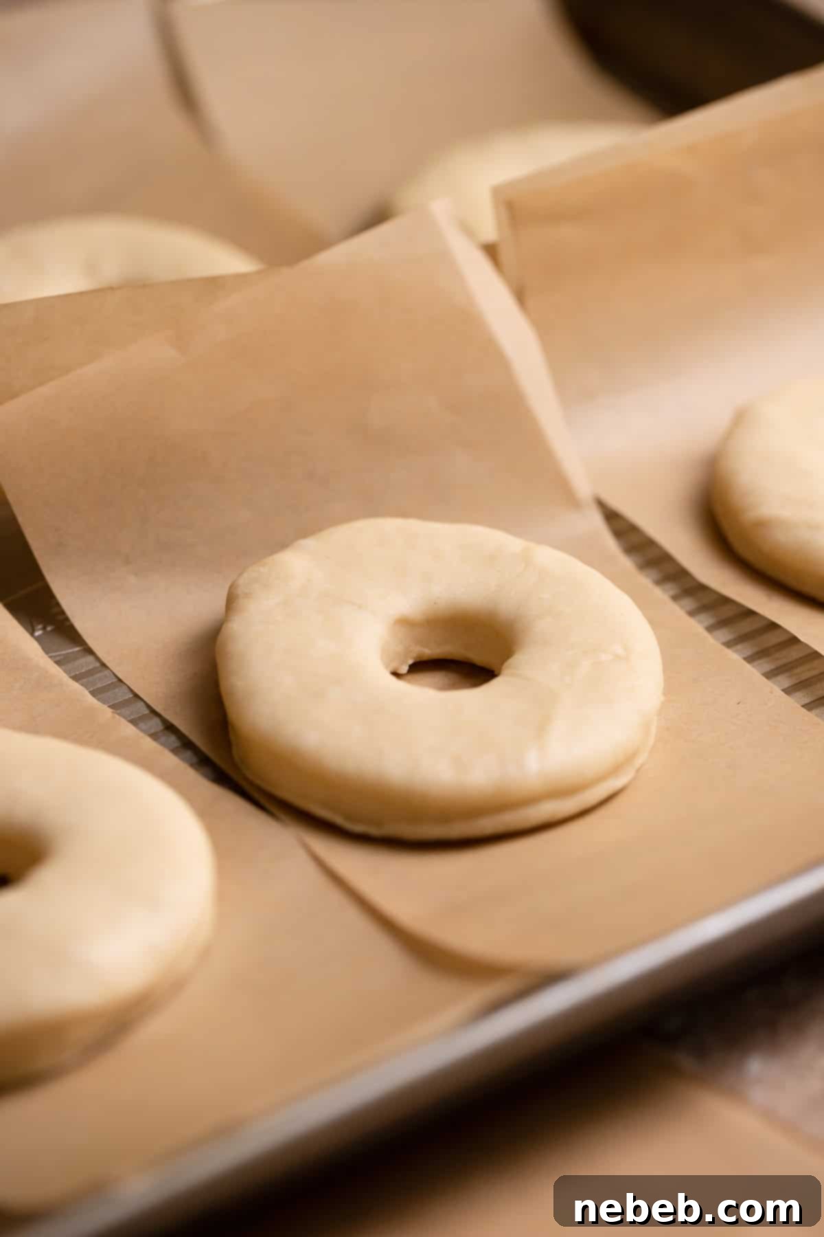 Pillowy Milk Bread Donuts 6 Cut out donuts on individual squares of parchment paper.