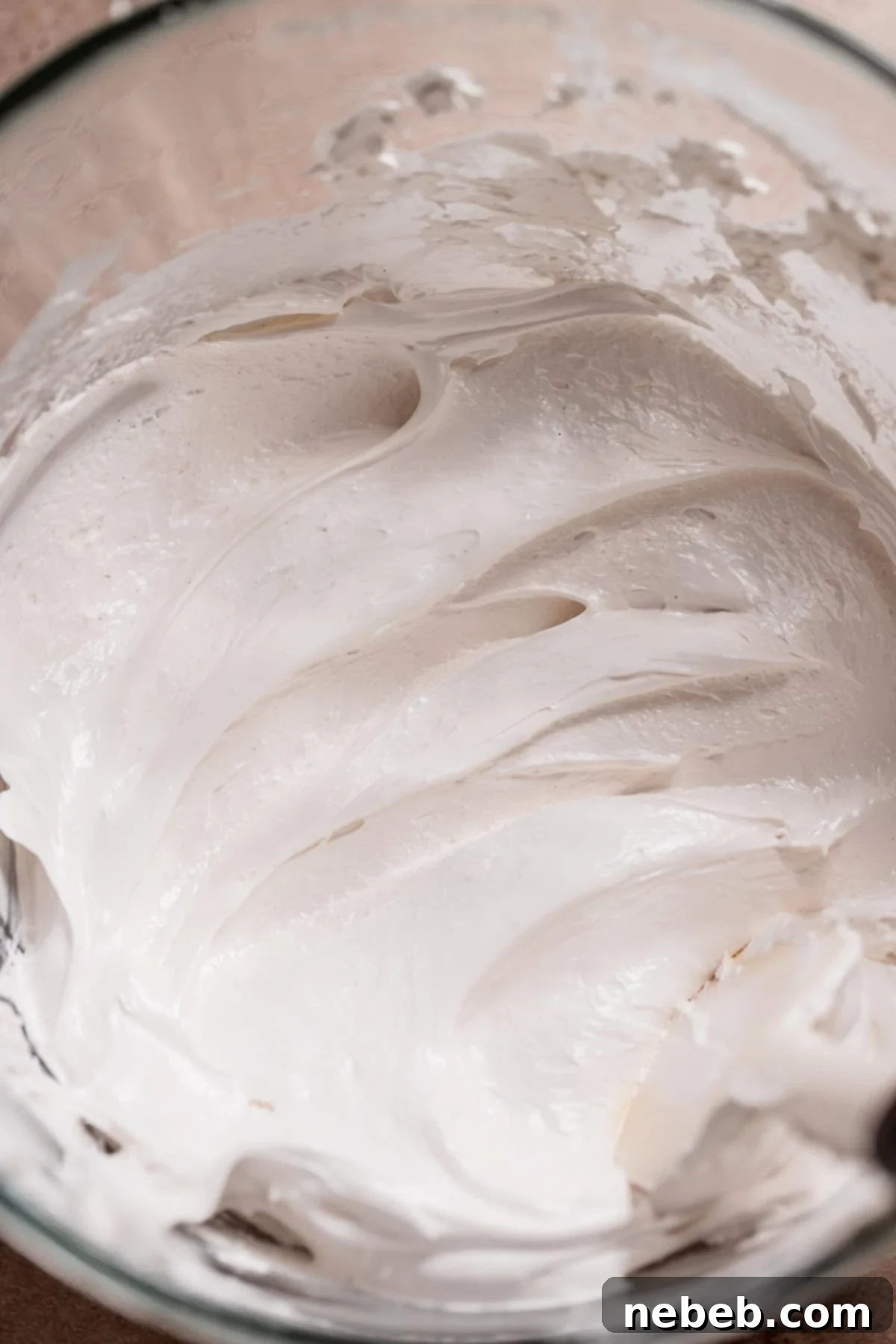Golden Marshmallow-Stuffed Cocoa Cupcakes 6 Light and airy homemade marshmallow fluff filling, whipped to perfection in a glass mixer bowl, ready for the hot cocoa cupcakes.
