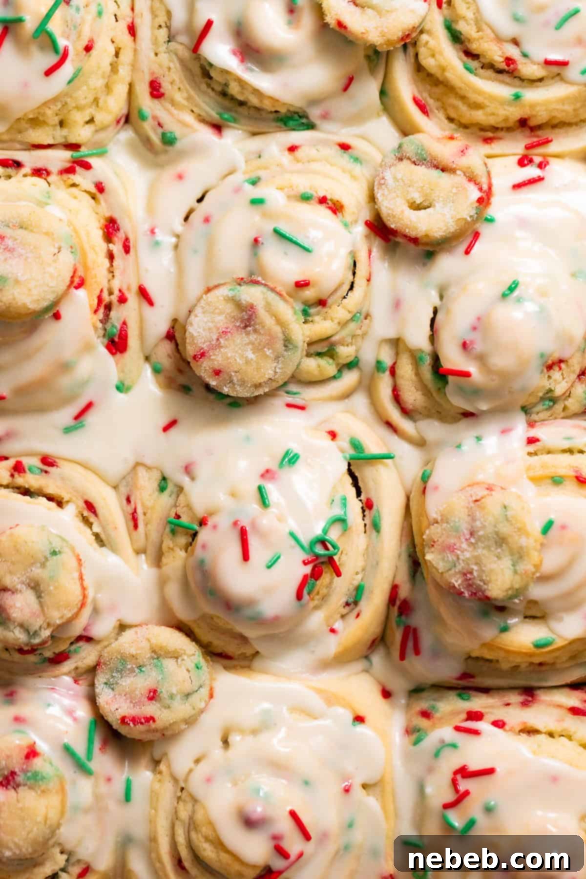 Christmas Swirl Sugar Cookie Bites 8 Christmas sugar cookie rolls, beautifully covered in creamy vanilla icing and festive holiday sprinkles.