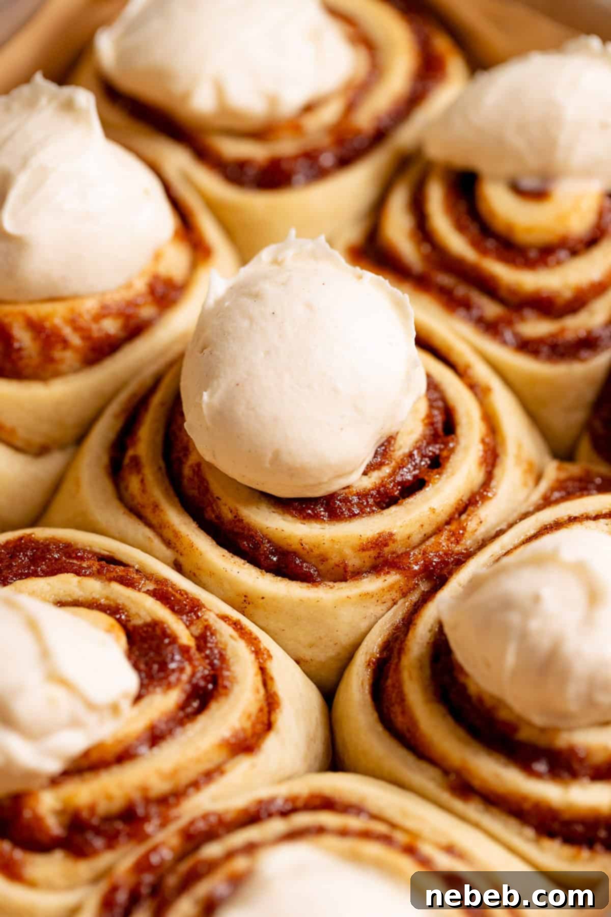 Banana Bread Cinnamon Rolls 10 Banana bread rolls generously frosted with cream cheese icing.